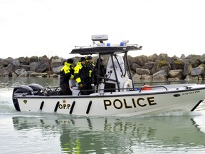 The OPP’s underwater search and recovery unit leaves Harbour Marina in Port Dover Wednesday morning in search of a Port Dover man who fell off a fishing tug Monday about 15 kilometres west of Long Point. – Monte Sonnenberg photo