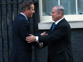 Britain's Prime Minister David Cameron (L) greets Israeli Prime Minister Binyamin Netanyahu in Downing Street on September 10, 2015 in London, England. Mr Netanyahu is in the United Kingdom on a two day visit.  (Photo by Carl Court/Getty Images)