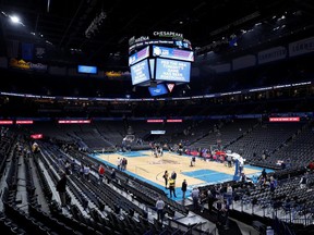 Fan leave after an announcement that the Oklahoma City Thunder vs. Utah Jazz game is canceled just before the tip off at Chesapeake Energy Arena.