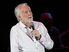 (FILES) In this file photo taken on March 18, 2017, Kenny Rogers performs live in concert on his 'Farewell Tour' during Rodeo Austin at the Travis County Expo Center in Austin, Texas. Country legend Kenny Rogers on March 4, 2018 scrapped the final dates on what he has billed as a farewell tour, citing unspecified health concerns. The 79-year-old singer, best known for the hits "Lady" and "The Gambler," has been "working through a series of health challenges," his management said in a statement. / AFP PHOTO / SUZANNE CORDEIRO