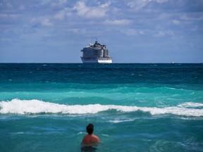 A cruise ship is seen on the Atlantic Ocean near the Miami Beach. Fla., this week. A man returning from a cruise intends to stay in a London house where his girlfriend lives with other tenants -- a plan the landlord wants public health officials to officially stop. (Chandan Khanna/AFP)