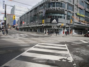 A few stay active on the empty streets of Toronto on Friday, March 20, 2020. (Veronica Henri/Toronto Sun)