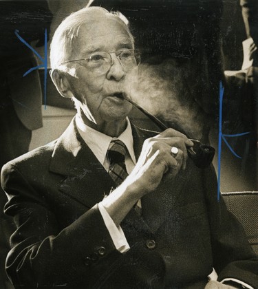 E.V. Buchanan, former PUC general manager, draws on his pipe, 1981. (London Free Press files)
