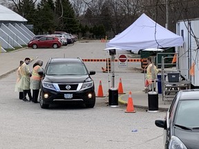 A single vehicle was at the Oakridge Arena COVID-19 assessment centre 30 minutes after its 11 a.m. opening Tuesday. (DEREK RUTTAN, The London Free Press)