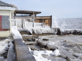 Lake Erie slams into structures on Erie Shore Drive in Chatham-Kent, Ont. on Sunday March 1, 2020. Residents of Erie Shore Drive have a deadline of March 9 to vacate their properties so that repairs can be made to the dike on top of which the road sits. Derek Ruttan/The London Free Press/Postmedia Network