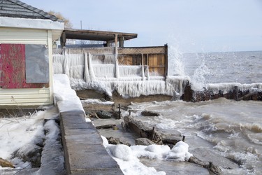 Lake Erie slams into structures on Erie Shore Drive in Chatham-Kent, Ont. on Sunday March 1, 2020. Residents of Erie Shore Drive have a deadline of March 9 to vacate their properties so that repairs can be made to the dike on top of which the road sits. Derek Ruttan/The London Free Press/Postmedia Network