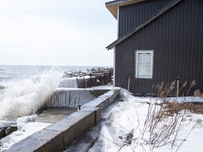 Lake Erie slams into structures on Erie Shore Drive in Chatham-Kent, Ont. on Sunday March 1, 2020. Residents of Erie Shore Drive have a deadline of March 9 to vacate their properties so that repairs can be made to the dike on top of which the road sits. Derek Ruttan/The London Free Press/Postmedia Network