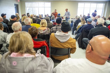 Don Shropshire, COO of Chatham-Kent (left) and Sean Panjer  address nearly 150 people at a meeting of the Erie Shore Drive Property Owners Association at the Erieau fire station in Erieau, Ont. on Sunday March 1, 2020. Panjer is a board member of the association.Derek Ruttan/The London Free Press/Postmedia Network