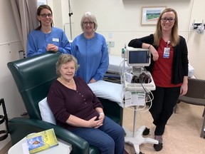 Cancer patient Darlene Sytsma (seated) and L to R registered nurses Julie Metzger, Sandra Fish and Kristen Knapper at the St. Thomas Elgin General Hospital in St. Thomas, Ont. on Tuesday. The London Regional Cancer Centre is setting up a sattelite operation at STEGH, moving a medical oncologist in there one day a week so patients can get their assessments and chemo without having to travel to London. (Derek Ruttan/The London Free Press)