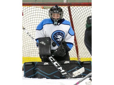 Lucas Vikings goalie Bry Baker makes a save during the TRVA Central girls hockey championship game against the Medway Cowboys at Stronach Arena in London on Thursday. (Derek Ruttan/The London Free Press)