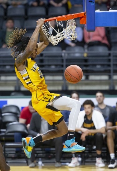 The London Lightning's AJ Gaines slam dunks two points against the Sudbury Five during their NBL game at Budweiser Gardens in London on Wednesday. (Derek Ruttan/The London Free Press)