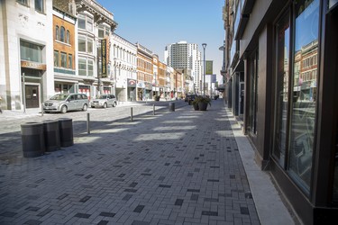 1:25pm The new sidewalks on Dundas Street in downtown London had few people using them on Sunday.  Derek Ruttan/The London Free Press/Postmedia Network