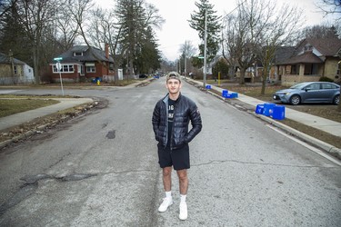 Western University social sciences student Matt Peretz stands in the middle of Broughdale Avenue where he shares a house with other students in London, Ontario. The street notorious for its large parties was empty on St. Patrick's Day, Tuesday March 17, 2020. Peretz spent the day packing as he is headed back home to Vancouver on Wednesday. Derek Ruttan/The London Free Press/Postmedia Network