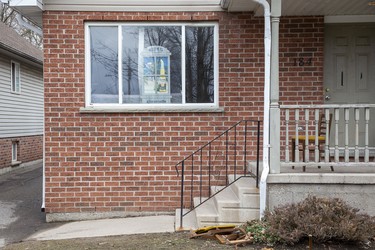 The house at 184 Broughdale Avenue in London, Ont. has a sign in the window that says Welcome To Coronaville. . The street notorious for its large parties was empty on St. Patrick's Day, Tuesday March 17, 2020.  Derek Ruttan/The London Free Press/Postmedia Network