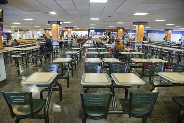 With classes cancelled and social distancing urged to help contain the novel coronavirus outbreak, it's a quiet lunchtime at the Western's University Community Centre food court in London on Tuesday, March 17. (Derek Ruttan/The London Free Press)