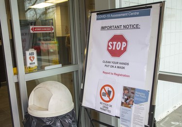 This sign greets visitors at the entrance of Oakridge Arena which has been transformed into a coronavirus assessment centre in London, Ont. on Tuesday March 17, 2020.  Derek Ruttan/The London Free Press/Postmedia Network