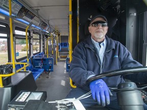 LTC bus driver Tim Pasma waits for people to board his empty number 13 Wellington Road bus at White Oaks Mall in London, Ont. on Wednesday March 18, 2020. He estimates that ridership has dropped by 80% over the last week. The bus eventually left the stop with one passenger on board. (Derek Ruttan/The London Free Press)
