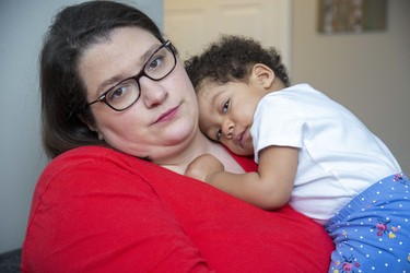 Danielle Lebel at home with her 16 month old daughter Lucca Jeanne Lebel-Allen in London, Ont. on Wednesday March 18, 2020. With her daycare cancelled Danielle is trying to find someone to look after Lucca Jeanne when she returns to work next week. (Derek Ruttan/The London Free Press)