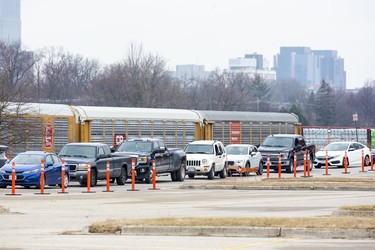 Drivers queue up to be seen at the newly opened COVID-19 assessment centre at Carling Heights Optimist Community Centre in east London Thursday, March 19. (Derek Ruttan/The London Free Press)