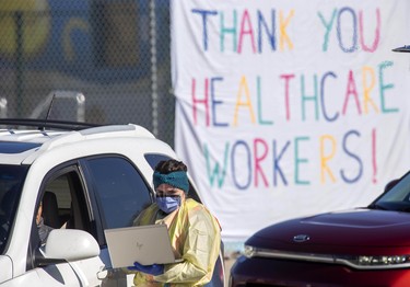 Someone has posted a large sign of appreciation at the Oakridge Arena COVID-19 assessment centre in London, Ont. on Saturday March 21, 2020. Derek Ruttan/The London Free Press/Postmedia Network