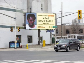 A billboard featuring a man wanted by police has recently appeared at the corner of Richmond Street and Horton Street in London. (Derek Ruttan/The London Free Press)