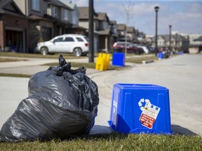 It was garbage day in north east London Ont. on Wednesday. (Derek Ruttan/The London Free Press)