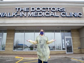 Christine Seguin is a medical office administrator at The Doctors Walk-In Medical Clinic in London. She and other staff members are wearing masks made by people who work at Da Ponte's Drapery. (Derek Ruttan/The London Free Press)