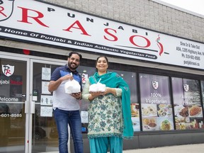 Harjinder Singh Dhaliwal and his wife Amandeep Kaur Dhaliwal own Punjabi Raso restaurant at 1295 Highbury Avenue in London. From noon to 4 pm everyday through Sunday April 5 they are giving away food to anyone that needs it. Just show up and you will be handed a bag containing a nice vegetarian meal consisting of things like rice, mixed vegetables, yogurt, naan bread and other food items. "The people are in crisis. We want to help the community and feed the people who are needy," said Harjinder. (Derek Ruttan/The London Free Press)