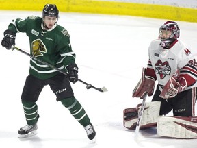 London Knights forward Connor McMichael tips the puck but can't get it past  Guelph Storm goalie Nico Daws in the third period of their OHL playoff game in London on Sunday April 7, 2019. (Derek Ruttan/The London Free Press)