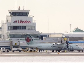London airport terminal and tower with an Air Canada Express commuter aircraft. (Mike Hensen, The London Free Press)