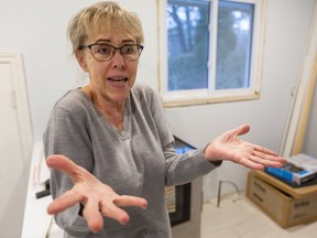 An exasperated Barbara Mazajlo stands in her barren London kitchen, unable to get answers about new cabinets she ordered from London cabinet maker Woody's Premium Cabinetry. (Mike Hensen/The London Free Press)