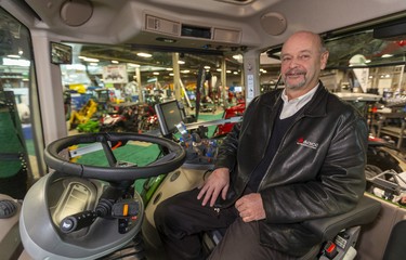 Eugene Evans, from Arkona, was at the London Farm show representing his employer Agco Corp on Wednesday March 4, 2020. Evans is the director of sales for the multinational company, handling sales from Maryland to Indiana, and from the Ontario-Manitoba border to the Maritimes. Evans allows that he travels "a bit," but "gets home enough that his wife and kids will recognize me." The German-made Fendt tractor Agco has on display has about 300 horse power and sells for $300,000 to $400,000 depending on how it's set up.
Mike Hensen/The London Free Press