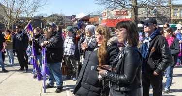 A crowd of more than 100 people gathered Sunday at Victoria Park for the rally celebrating International Women's Day before they marched to the London Library on Dundas Street in London. (Mike Hensen/The London Free Press)