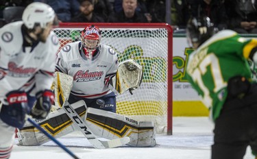 Matvey Guskov of the London Knights fires a shot at Jordan Kooy of the Oshawa Generals early in their game Sunday at Budweiser Gardens in London. Photograph taken on Sunday March 8, 2020. Mike Hensen/The London Free Press/Postmedia Network
