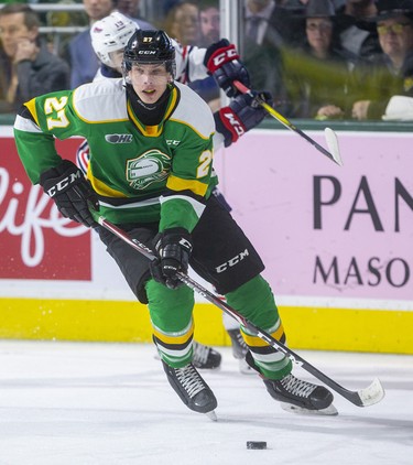 Kirill Steklov of the London Knights carries the puck out of his end while being chased by Oliver Suni of the Oshawa Generals in their game Sunday at Budweiser Gardens in London. Photograph taken on Sunday March 8, 2020. Mike Hensen/The London Free Press/Postmedia Network