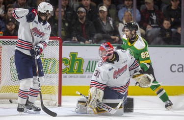 London Knights forward Jason Willms watches the puck bounce off the netting after captain Liam Foudy scored on a wrist shot from the circle, beating Oshawa goalie Jordan Kooy as defence man William Ennis watches in their game at Budweiser Gardens in London. Photograph taken on Sunday March 8, 2020. Mike Hensen/The London Free Press/Postmedia Network