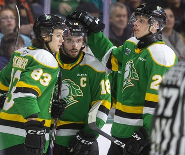 London Knights captain Liam Foudy gets a pat on the head from Kirill Steklov and congrats from Hunter Skinner as Foudy opened the scoring in their game against the Oshawa Generals in Budweiser Gardens on Sunday. Photograph taken on Sunday March 8, 2020. Mike Hensen/The London Free Press/Postmedia Network