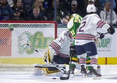 Connor McMichael of the Knights doesn't often come up empty with a gaping net, but Oshawa goalie Jordan Kooy gets his right pad out to stop the Knights goalscorer who is being checked by Lleyton Moore of the Generals in their game at Budweiser Gardens in London. Photograph taken on Sunday March 8, 2020. 
Mike Hensen/The London Free Press/Postmedia Network