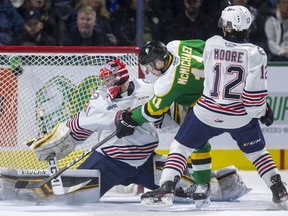 Connor McMichael of the London Knights doesn't often come up empty with a gaping net, but Oshawa goalie Jordan Kooy gets his right pad out to stop the Knights goalscorer, who is being checked by Lleyton Moore of the Generals, in a March 8, 2020, game at Budweiser Gardens. (Mike Hensen/The London Free Press)