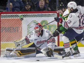 Connor McMichael of the Knights doesn't often come up empty with a gaping net, but Oshawa goalie Jordan Kooy gets his right pad out to stop the sniper, who is being checked by Lleyton Moore of the Generals in their game at Budweiser Gardens in London. Photograph taken Sunday. (Mike Hensen/The London Free Press)