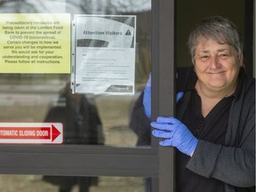 Donna Speller, the volunteer co-ordinator for the London Food bank says they are asking clients to wait outside and only serving 4 at a time in order to allow for proper social distancing in their waiting areas in London, Ont.  Speller says the goal is to stay open as long as possible, "and to give out food for as long as we can." Speller says she's already noticed a dip in her volunteers, noting that many of them are older. Photograph taken on Monday March 16, 2020.  (Mike Hensen/The London Free Press)