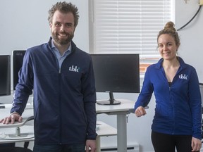 Andrew Schiestel, president of tbk, and Kylie McConnell, director of accounts, announced Monday they will help companies set up to have employees work from home. Tbk is a marketing and software company in London. (Mike Hensen/The London Free Press)