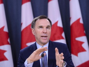 Minister of Finance Bill Morneau takes part in a press conference at the National Press Theatre in Ottawa on Friday, March 13, 2020. Morneau is poised to announce billions in federal aid to help cushion the financial shock of the COVID-19 outbreak on Canadians. THE CANADIAN PRESS/Sean Kilpatrick