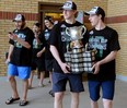 London Knights co-captains Mitch Marner, right, and Christian Dvorak carry the Memorial Cup to show thousands of fans who showed up to greet them in Victoria Park on Monday May 30, 2016. (File photo)