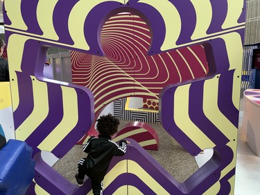 Two-year-old Major of Toronto scampers inside the dazzling maze at the Ontario Science Centre. He and other children are challenged to make it through to the other side without touching any edges. (BARBARA TAYLOR, The London Free Press)