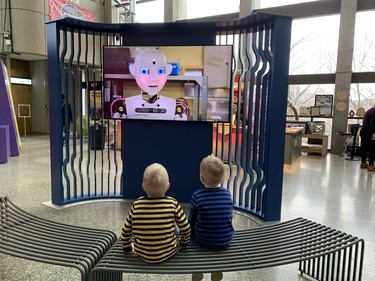 A Mindworks exhibit video at Ontario Science Centre captures the imagination of curious young Torontonians Luke and Jacob. (BARBARA TAYLOR, The London Free Press)