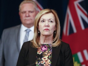 Premier Doug Ford , Christine Elliott, Deputy Premier and Minister of Health at the podium and Rod Phillips, Minister of Finance update about the  state of emergency amid coronavirus pandemic. (Veronica Henri/Toronto Sun/Postmedia Network)