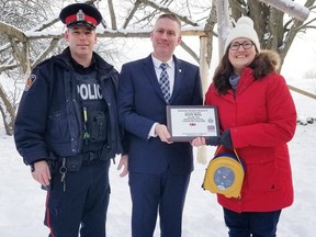 On Jan. 30 West Grey Police Service and Grey Bruce Ontario Provincial Police presented a defibrillator to Edge Hill Country School in Durham. The device was presented to the school in memory of OPP Constable Orval Storey, who was killed in the line of duty in 1936. The defibrillator is the 120th device donated by the Dave Mounsey Memorial Fund. The fund is dedicated to the donation of life-saving defibrillators to public buildings in the name of fallen law enforcement, fire, EMS and military members who have died in the line of duty. On Oct. 14, 2006 OPP constable Dave Mounsey was on route to a vehicle roll over. He lost control of his cruiser due to the ice and snow covered roads, striking a telephone pole and rolling. Constable Mounsey was extricated and sent by helicopter to hospital. On Nov. 13, 2006 he died while never having regained conscious. If you would like to know more about the Dave Mounsey Memorial Fund visit www.davemounsey.com. Taking part in the presentation in Durham are, from left, West Grey Police Service constable Chad Brown, executive director of the memorial fund and Perth County OPP sergeant Patrick Armstrong and Marlea Gray, who initiated the donation request on behalf of the school.