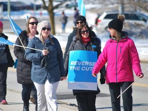 The Ontario English Catholic Teachers Association and AEFO, the French language teachers union, hit the picket lines across the province on Mar. 5. Here, picekters hold a strike in Walkerton. KEITH DEMPSEY