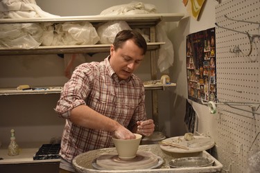 Porcelain artist Chad Luberger works at his wheel at Plum Bottom Gallery in rural Door County. WAYNE NEWTON/SPECIAL TO LONDON FREE PRESS/POSTMEDIA
